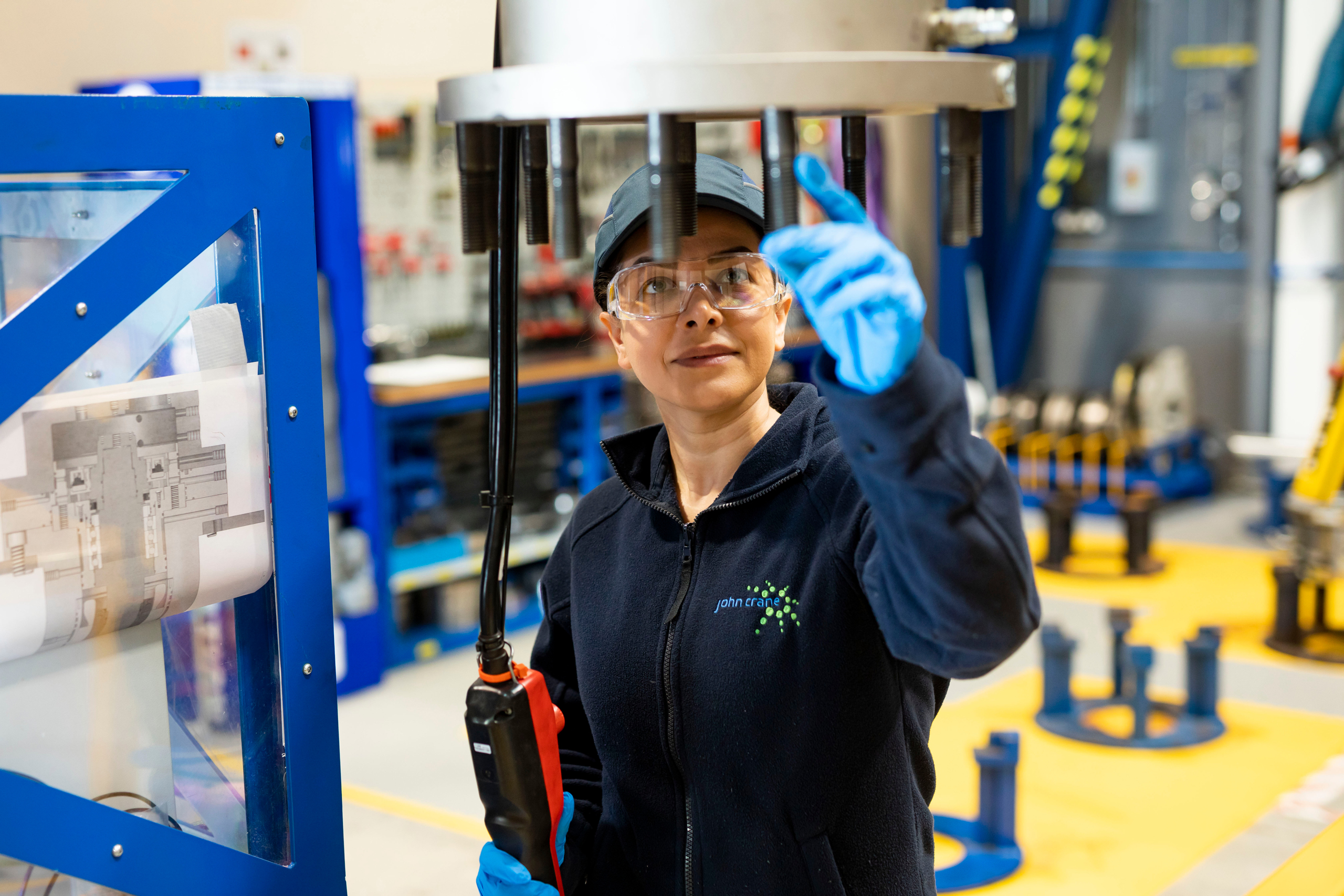 John Crane Employee Working At Machine